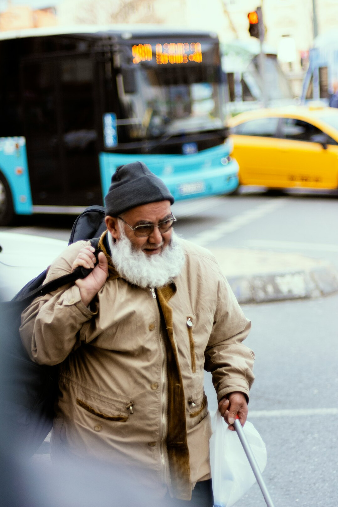 Portrait of a cheerful senior man with glasses and white beard