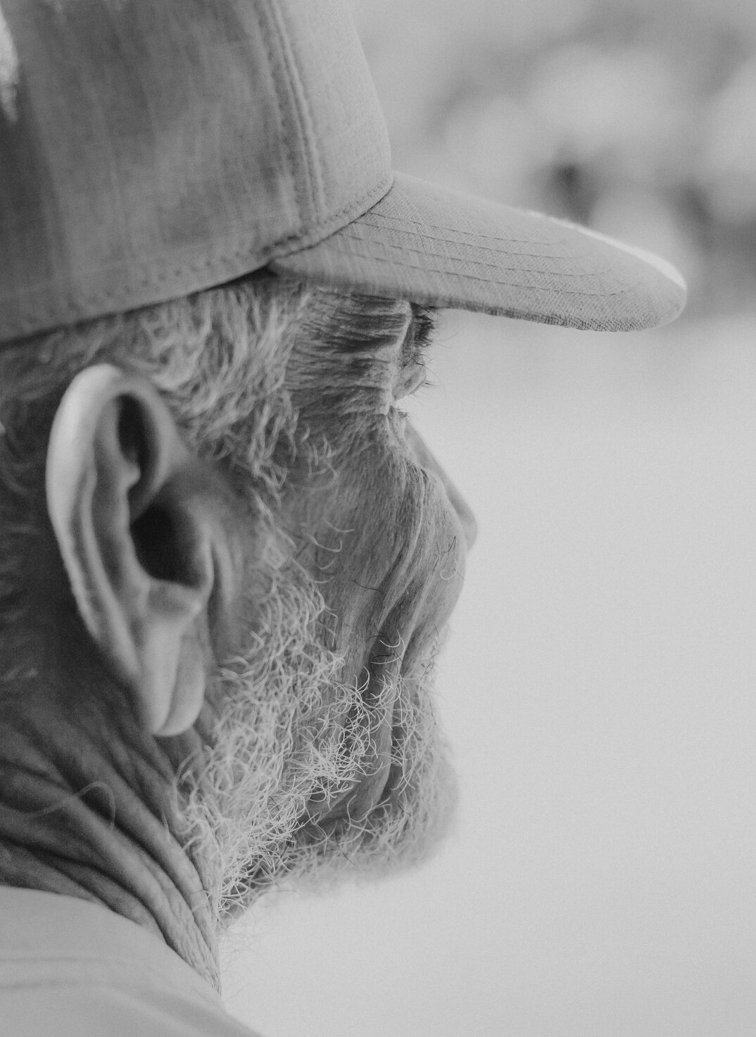 Portrait of a senior man with a flat cap smiling