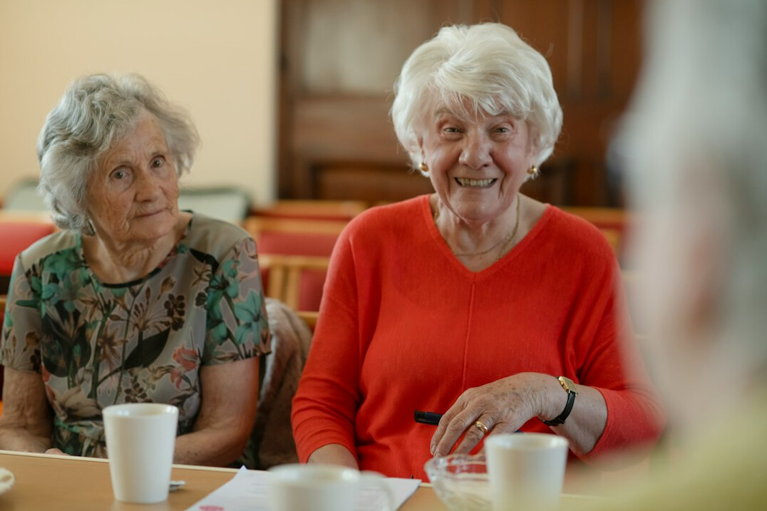 group of smiling seniors chatting