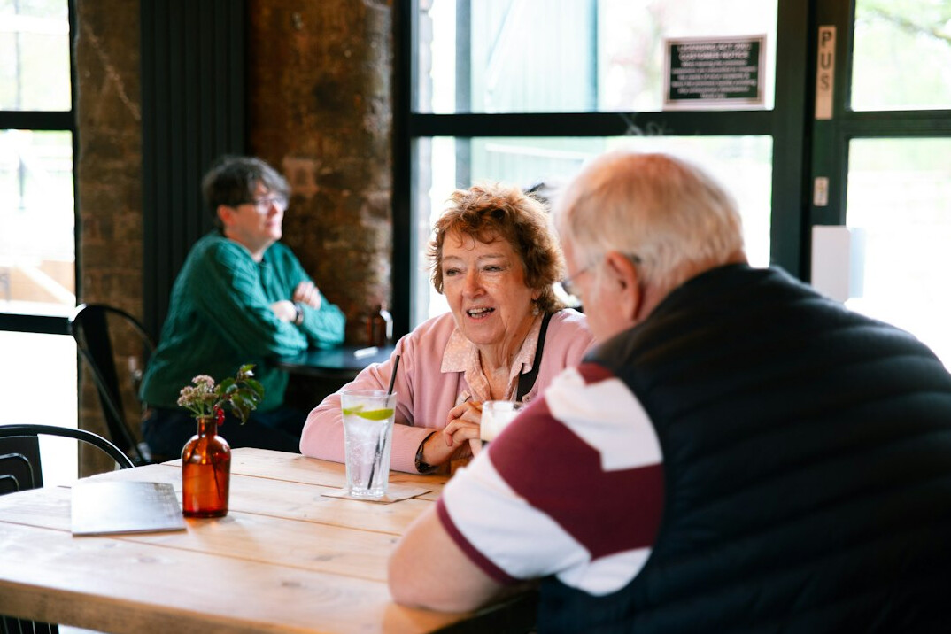 senior friends laughing together