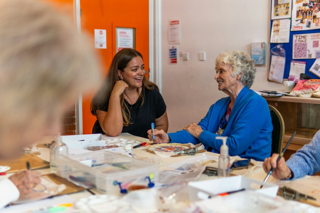 senior people chatting in community center